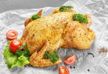 Marinaded chicken with garnish on parchment