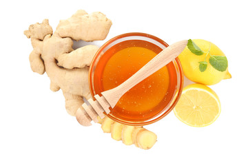 Fototapeta na wymiar Natural medicine concept. Honey, lemon and ginger on white background