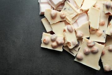 Broken chocolate pieces with hazelnut, close up