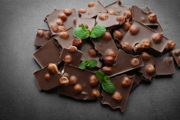 Broken chocolate pieces with hazelnut, close up