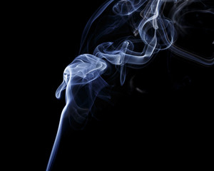 Abstract art. Color white blue smoke from the aromatic sticks on a black background. Background for Halloween. Texture fog. Design element. The concept of aromatherapy.