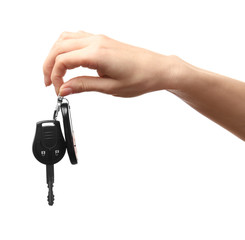 Female hand holding car keys on white background