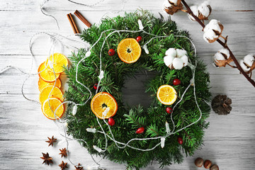 Beautiful Christmas wreath on table