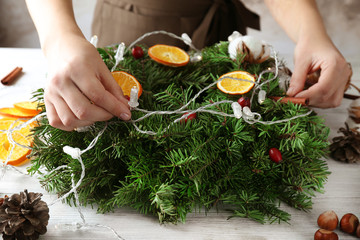 Woman making Christmas wreath