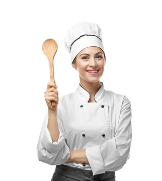Portrait of female chef with wooden spoon isolated on white