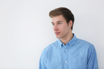 Handsome young man on light background