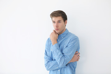 Handsome young man on light background