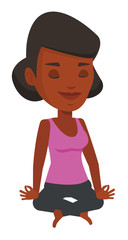 Woman meditating in yoga lotus pose.