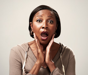 Happy surprised black woman