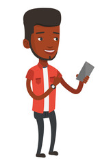 Young smiling man holding mobile phone.