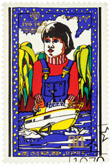 Boy with toy ship on postage stamp