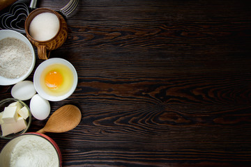 Baking ingredients for pastry on the wooden background
