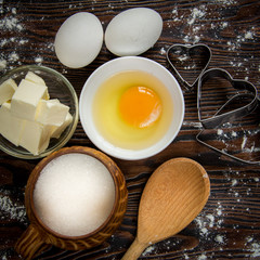 Baking ingredients for pastry on the wooden background