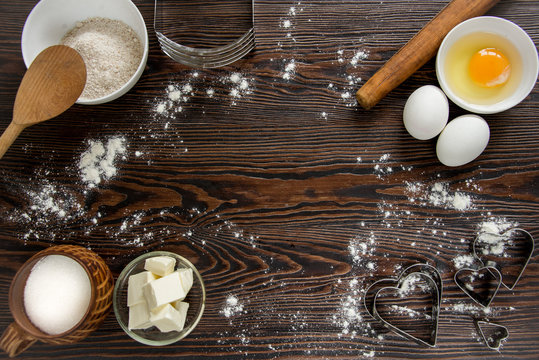 Baking ingredients for pastry on the wooden background