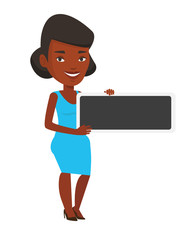 Young african-american woman holding blank board.