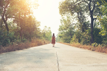 Woman skirt and sneaker shoes Walking on the road and park