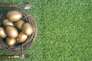 golden eggs on grass