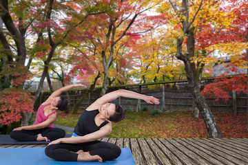 Yoga and meditation at autumn garden.