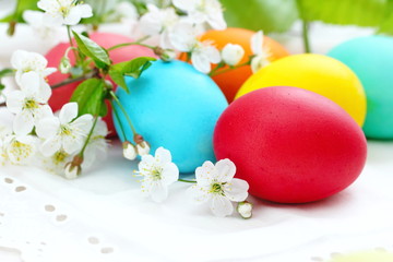 Easter eggs and flowers in basket