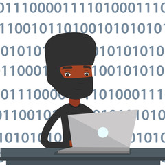 Hacker using laptop to steal information.