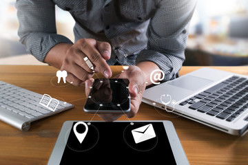 man hand holding smartphone device and  technology , businessman working with modern devices, digital tablet computer and mobile phone.