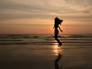silhouette woman on the beach