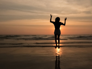 silhouette woman on the beach