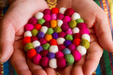colorful handmade fabric and colorful wool .
