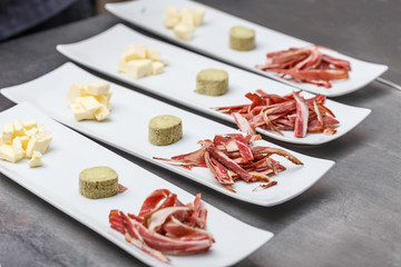 Many plates of appetizers