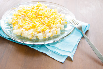Festive salad with chicken breast, sweet corn, cheese and pineapple