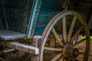 The old wheel of a cart in barn