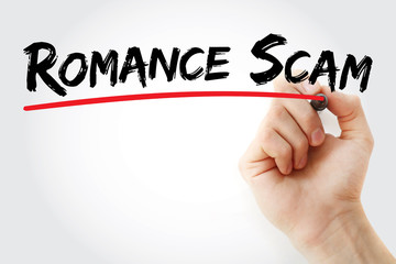 Hand writing romance scam with marker, concept background