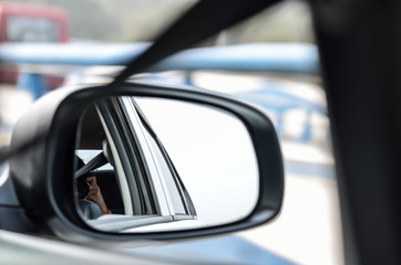 Rear view mirror reflecting car