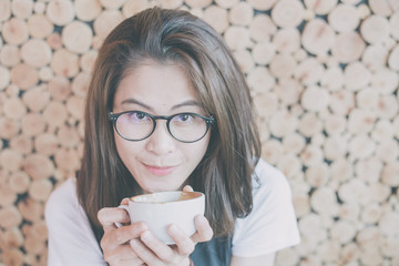 Portrait of asian women drink the hot coffee in the cafe shop.