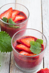 fruit pudding with chia and strawberry and mint close-up view from above.