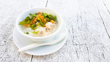 Boiled rice pork in white bowl on the table