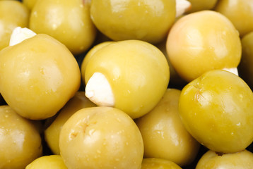 Green olives stuffed with almonds  as  food  background