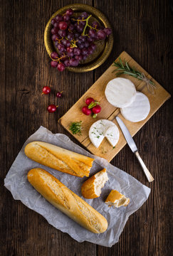 Cheese, radish, grapes and baguette