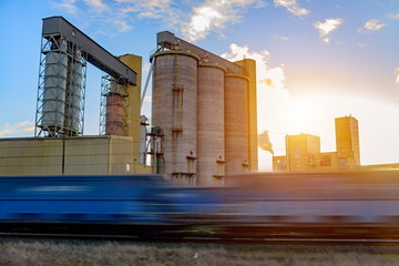 Industrial train arrives at the enterprise. Train blurred. Post processing.