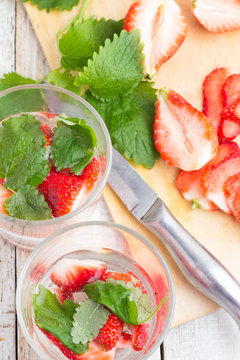 refreshing drink with strawberries and mint in a glass