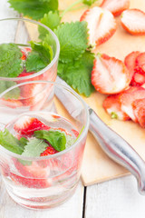 glasses with a drink of strawberries and mint closeup