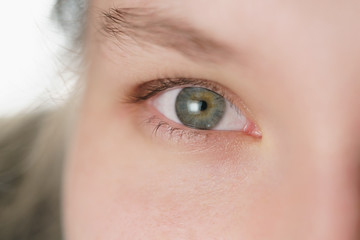 Obraz premium Closeup of teenage girl part face portrait looking straight, shallow focus