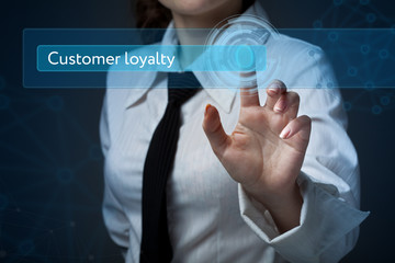 Business, technology, internet and networking concept. Business woman presses a button on the virtual screen: customer loyalty