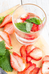 drink with strawberries and mint on a white background closeup