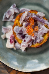 Potato pancake with glazed red onion