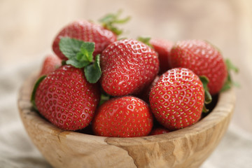 fresh strawberries in bowl on napkin on table, organic garden berries