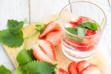 drink with strawberries and mint in a glass