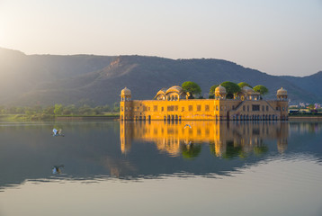 The Palace Jal Mahal (Water Palace) in the middle of Man Sager Lake at sunrise, Jaipur, Rajasthan,...