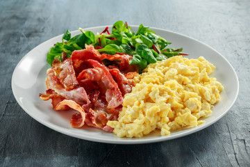Morning Scrambled egg, bacon breakfast on white plate