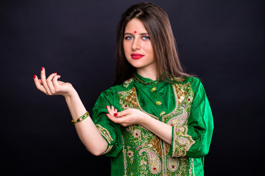 Portrait of beautiful eastern woman in green sari